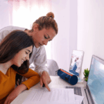Parent helping child stay motivated for home school